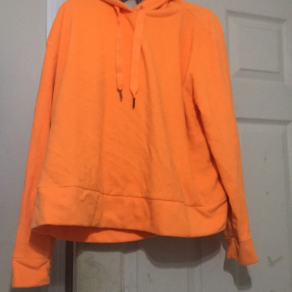 A neon orange hooded sweatshirt